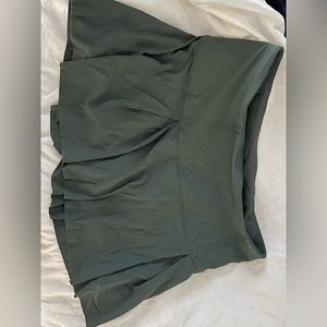 Lululemon green lost in pace tennis skirt. I cut the tag off— was size 6-8 (M)